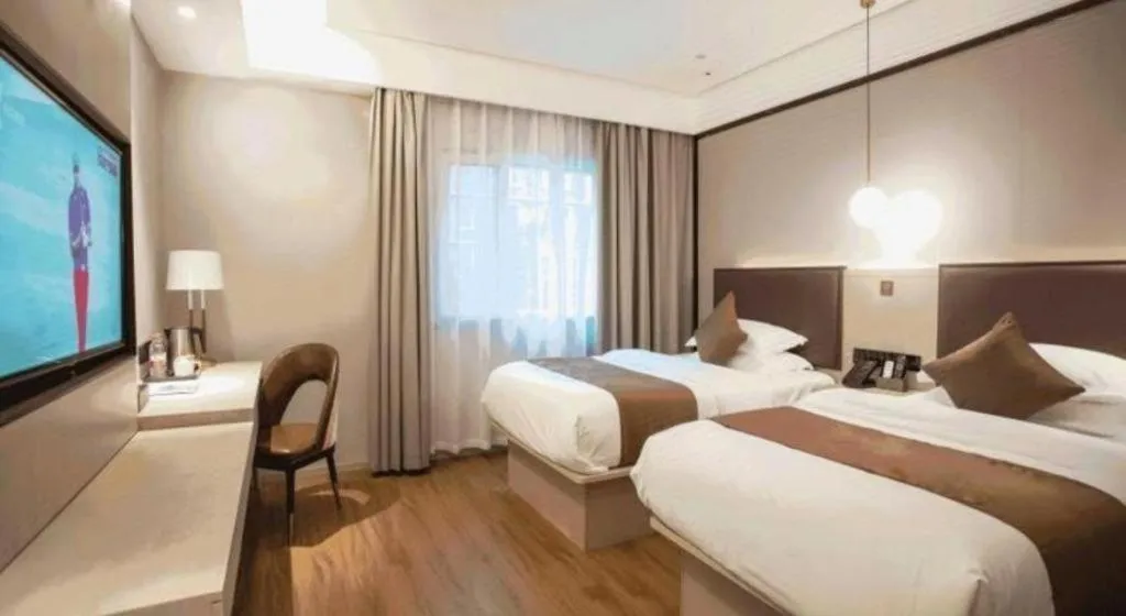 Bed in GYA Shanghai Jiangpu Hotel