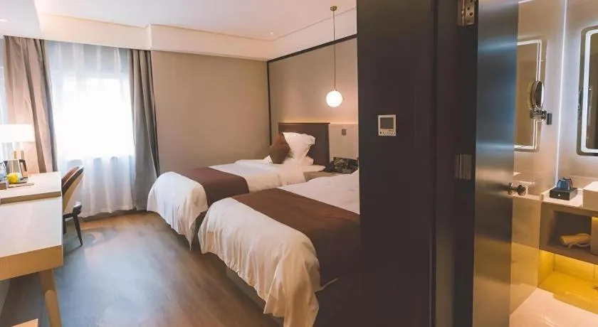 Bed in GYA Shanghai Jiangpu Hotel