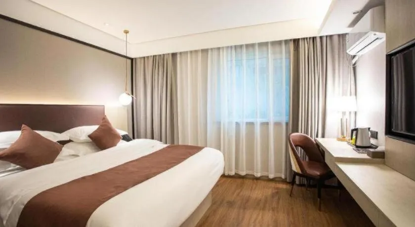 Bed in GYA Shanghai Jiangpu Hotel