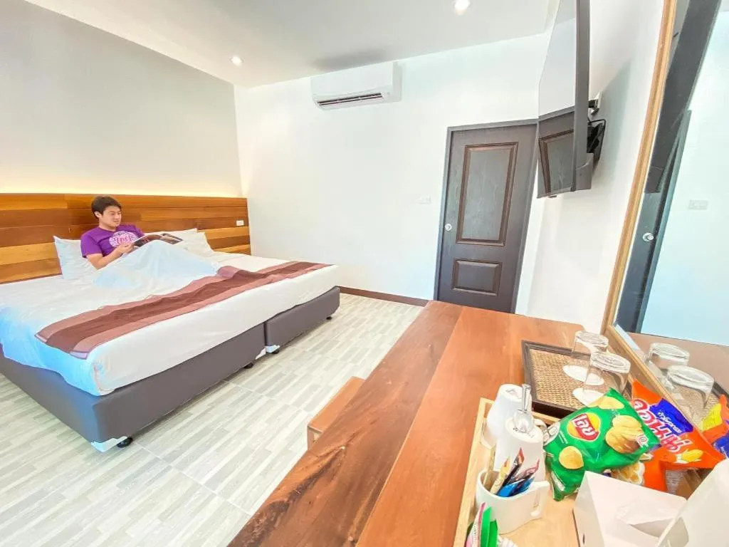 Bed in Rattana Pura Beach Resort