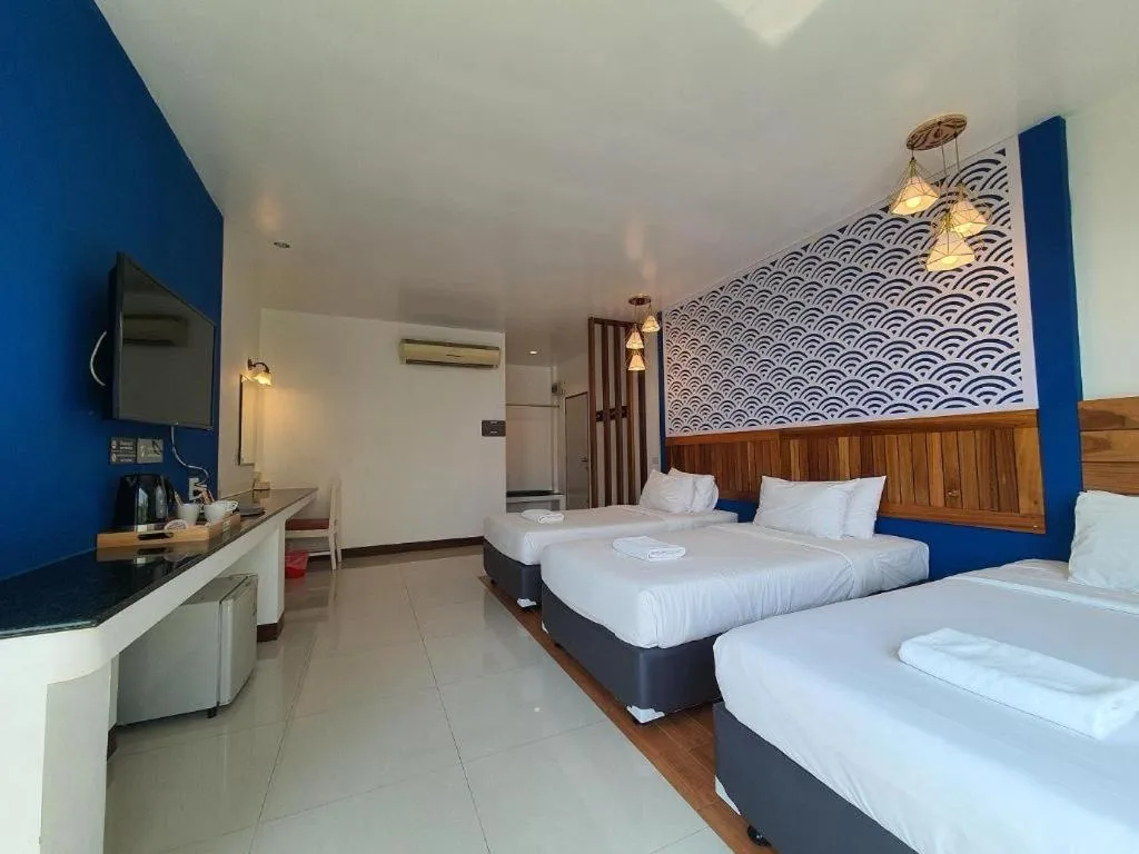 Bed in Rattana Pura Beach Resort