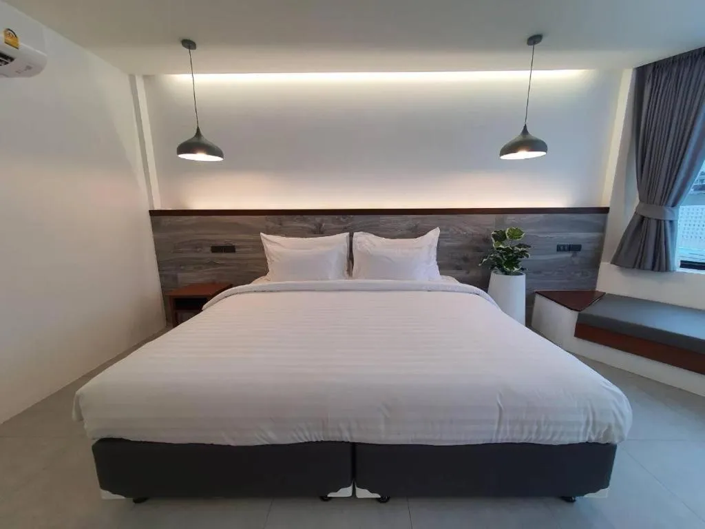 Bed in Rattana Pura Beach Resort