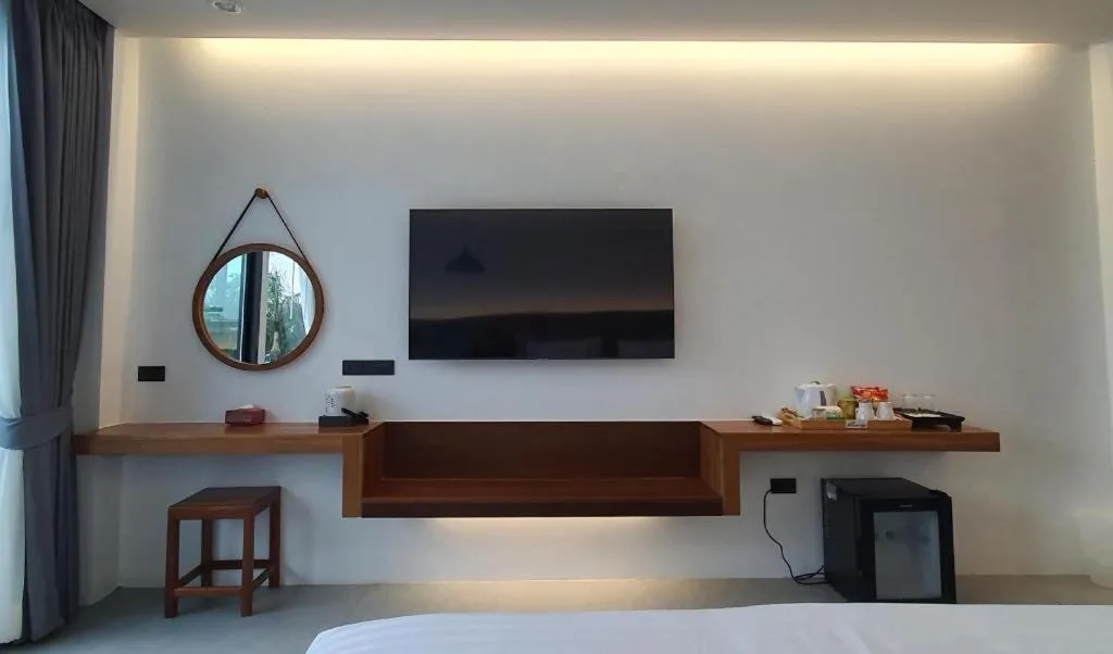 Bed in Rattana Pura Beach Resort