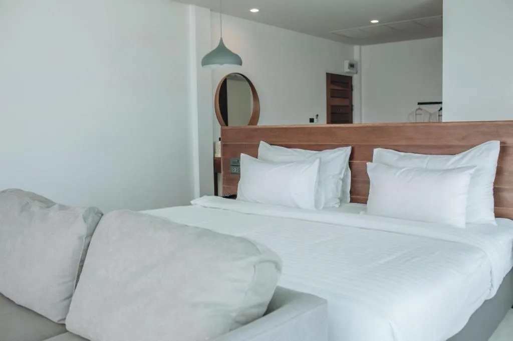 Bed in Rattana Pura Beach Resort