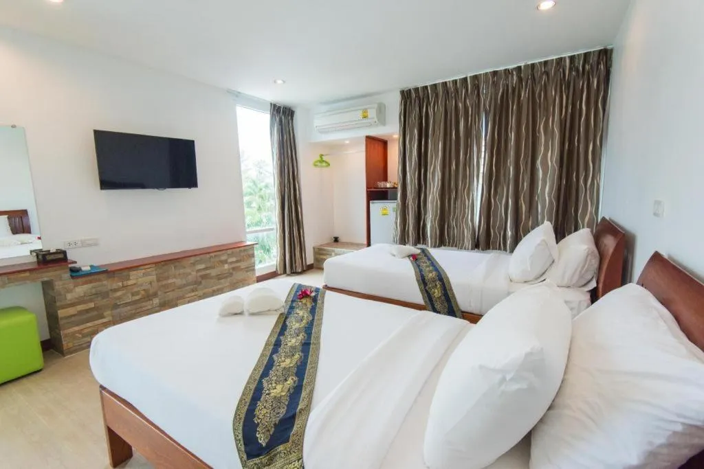 Bed in Rattana Pura Beach Resort