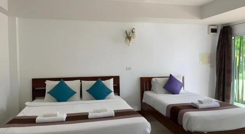 Bed in Rattana Pura Beach Resort