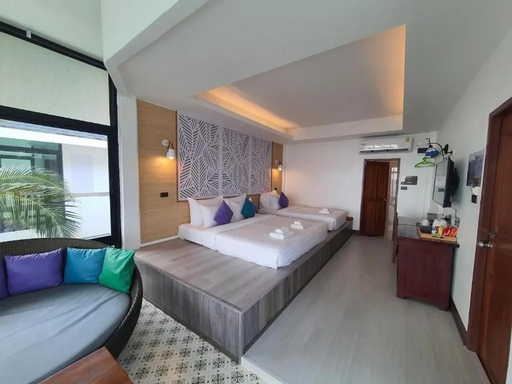 Bed in Rattana Pura Beach Resort