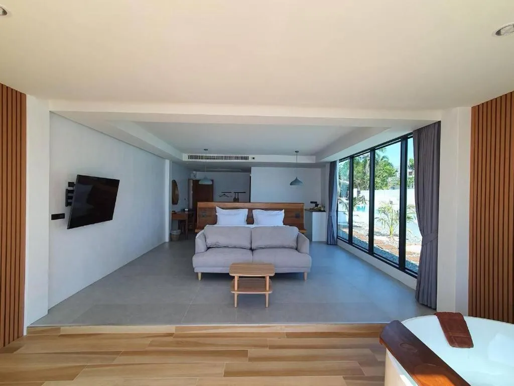 Bed in Rattana Pura Beach Resort