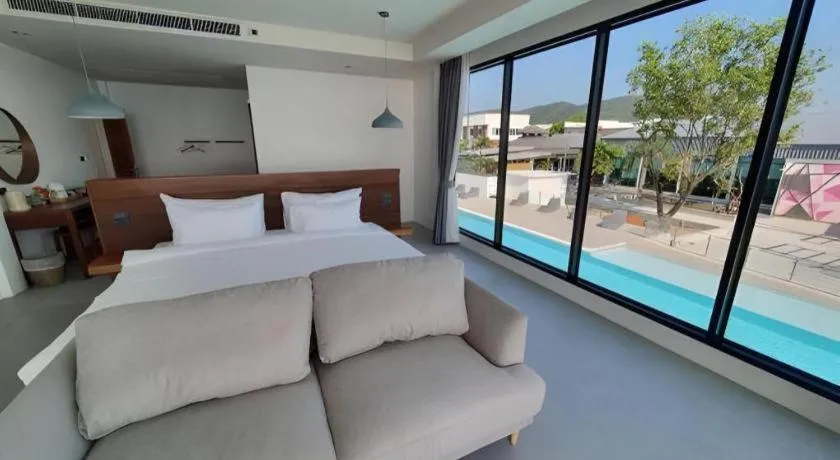 Bed in Rattana Pura Beach Resort