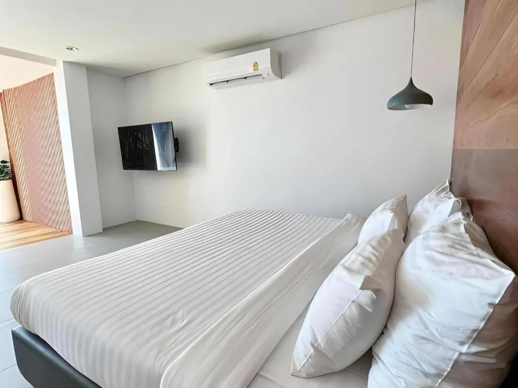 Bed in Rattana Pura Beach Resort