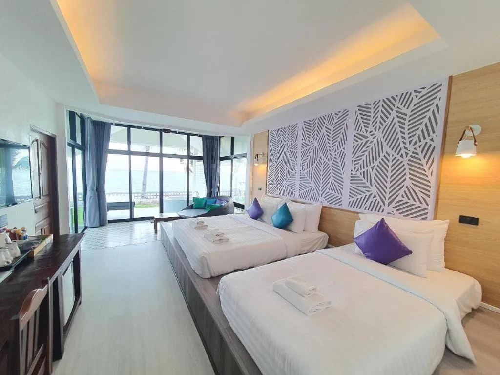 Bed in Rattana Pura Beach Resort