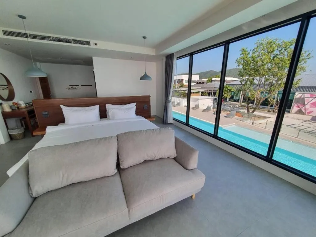 Bed in Rattana Pura Beach Resort