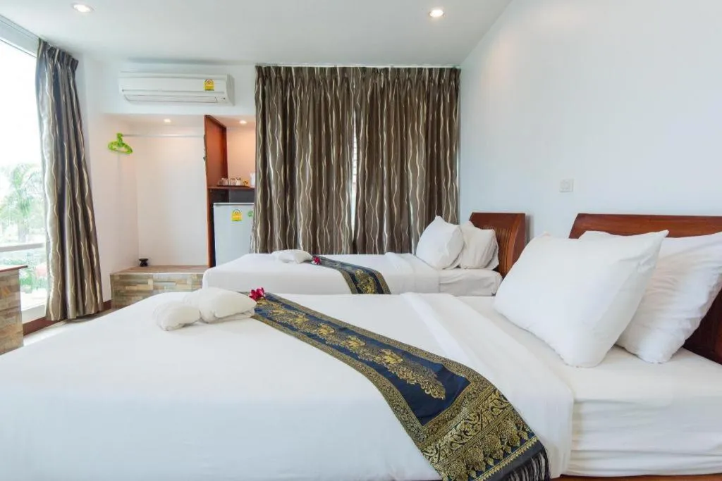 Bed in Rattana Pura Beach Resort