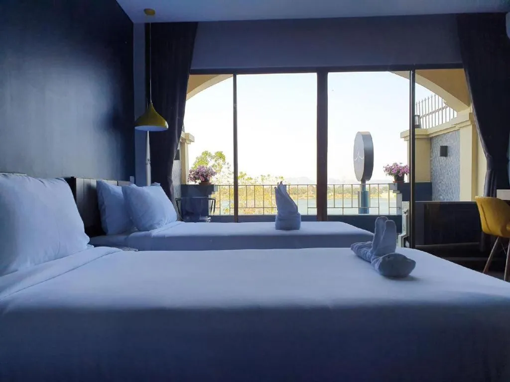 Bed in THE S VILLAS HOTEL