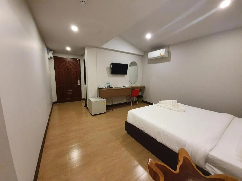 Bed in THE S VILLAS HOTEL