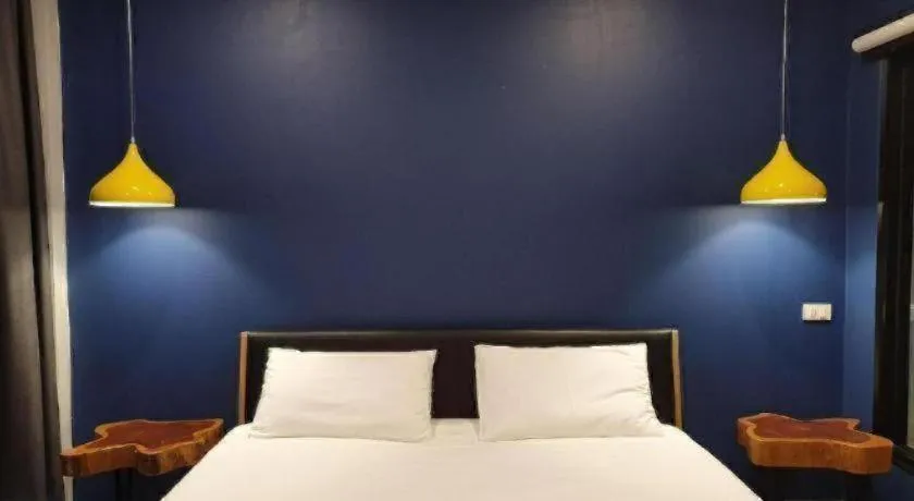 Bed in THE S VILLAS HOTEL