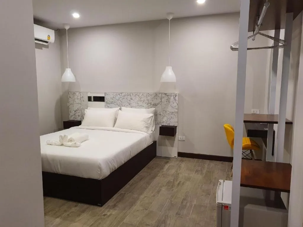 Bed in THE S VILLAS HOTEL