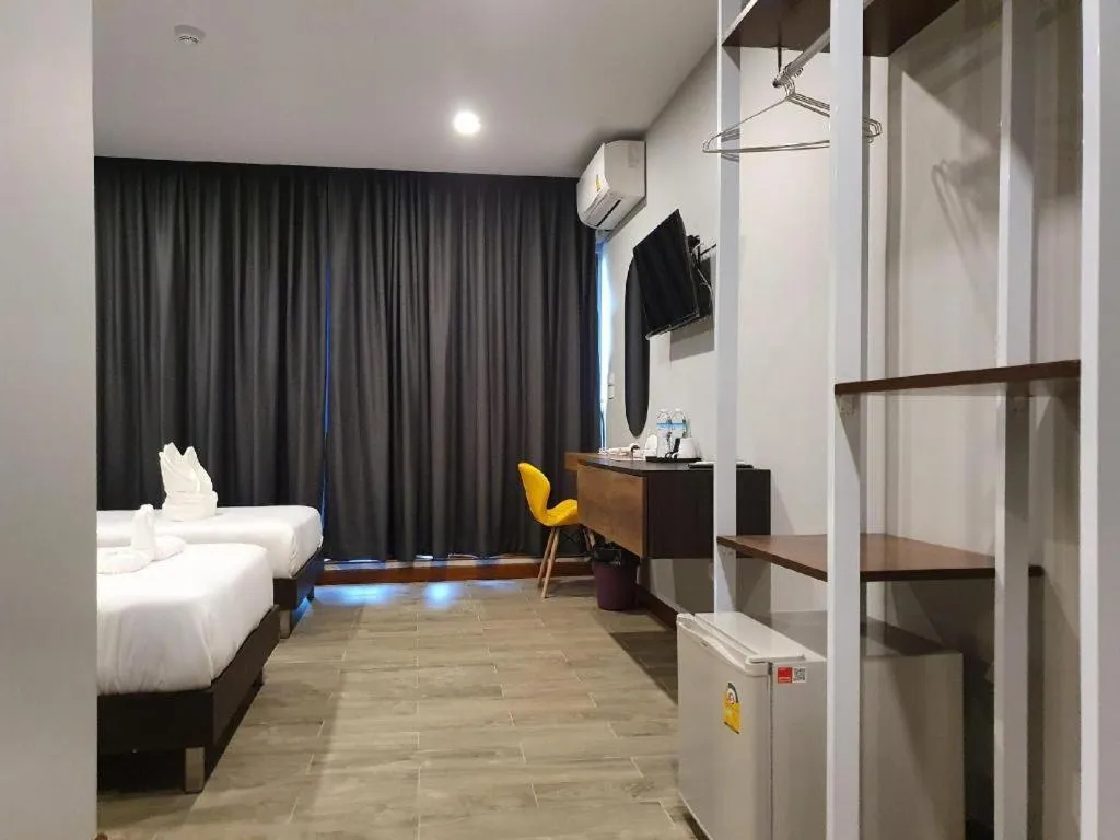 Bed in THE S VILLAS HOTEL