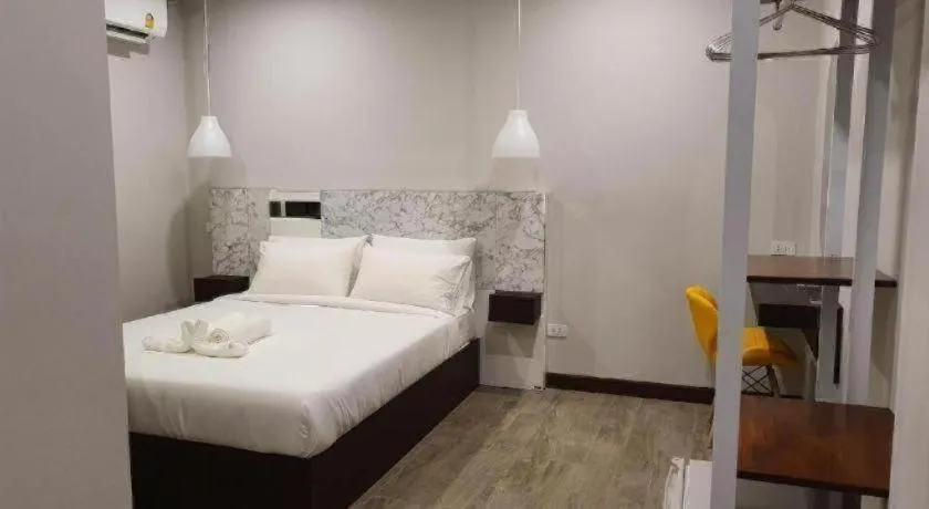 Bed in THE S VILLAS HOTEL