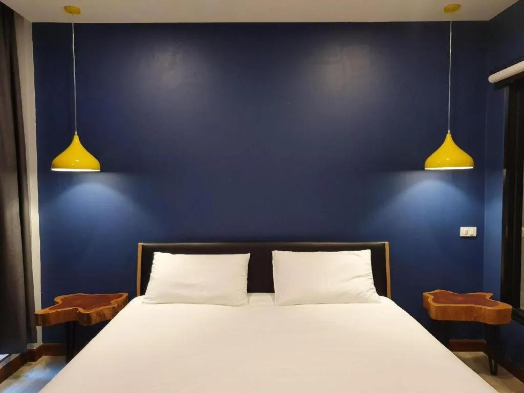 Bed in THE S VILLAS HOTEL