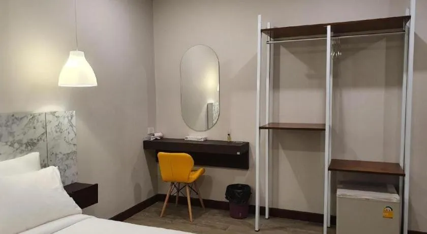 Bed in THE S VILLAS HOTEL