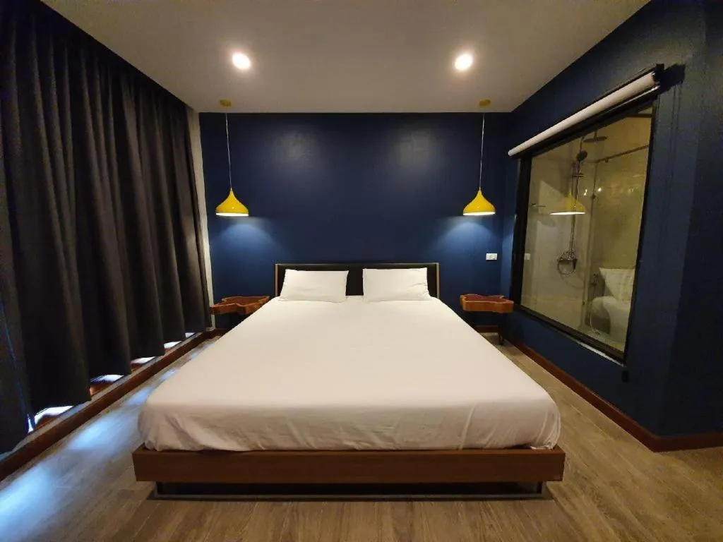 Bed in THE S VILLAS HOTEL