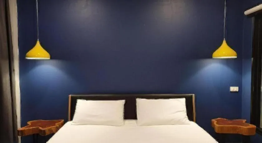 Bed in THE S VILLAS HOTEL