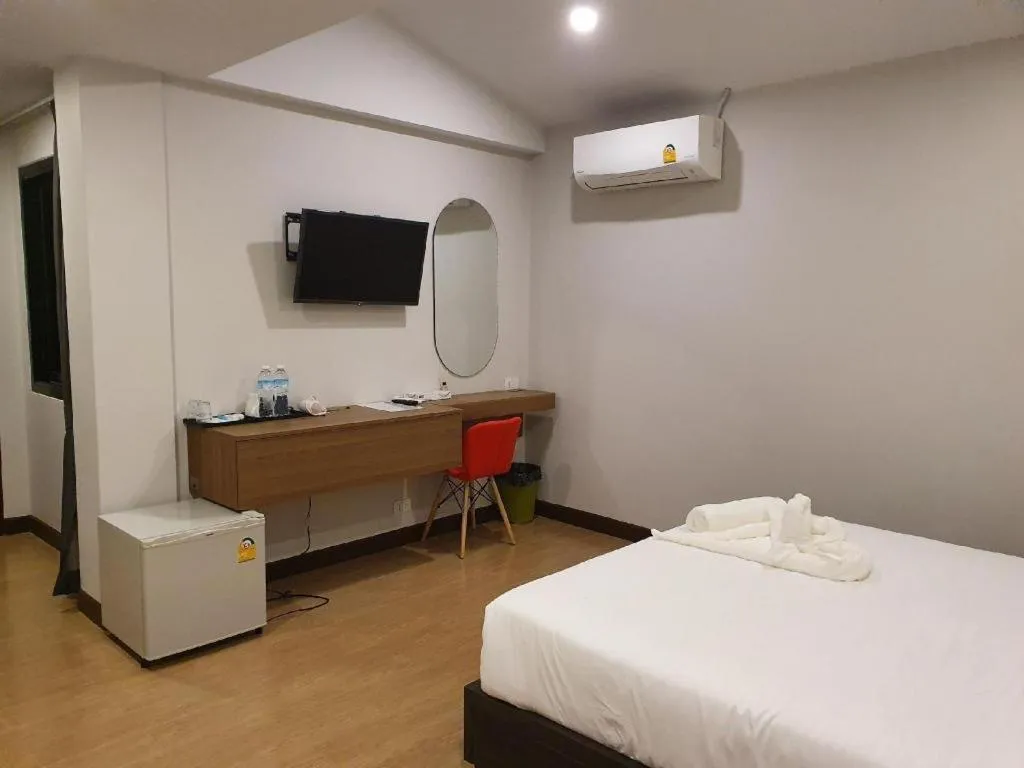 Bed in THE S VILLAS HOTEL