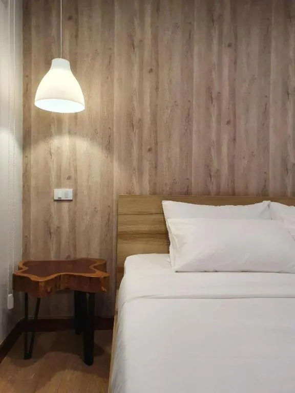 Bed in THE S VILLAS HOTEL