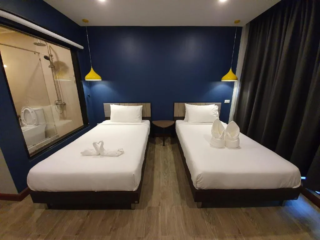 Bed in THE S VILLAS HOTEL