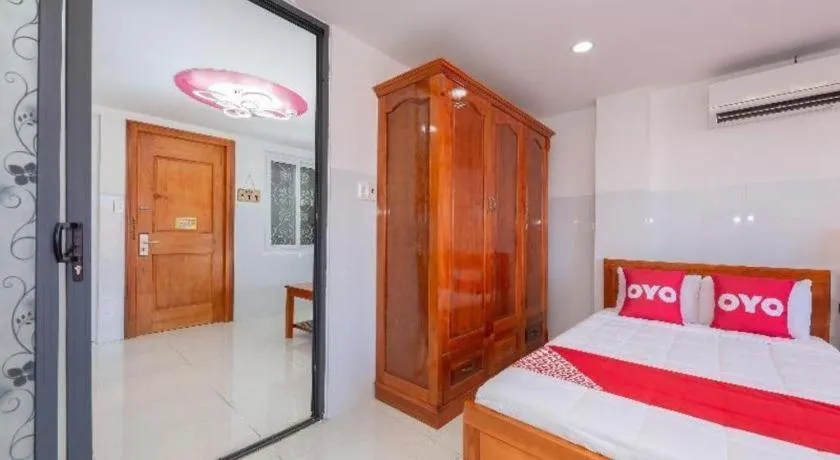 Bed in OYO 1028 Flower House Apartment