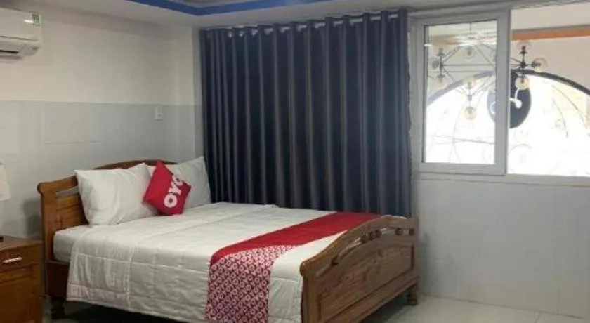 Bed in OYO 1028 Flower House Apartment