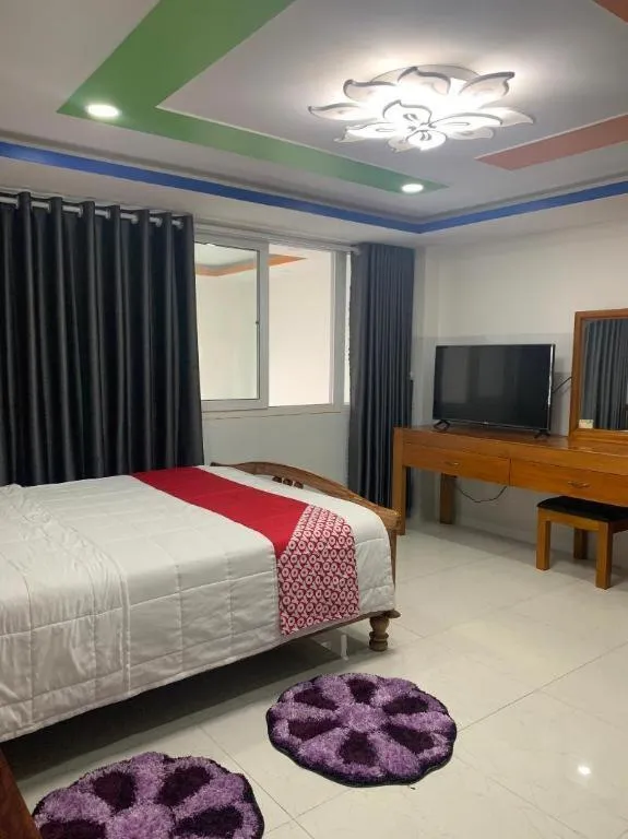 Bed in OYO 1028 Flower House Apartment