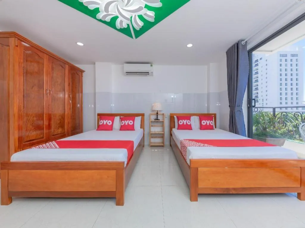 Bed in OYO 1028 Flower House Apartment