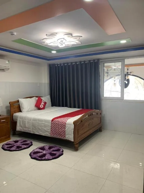 Bed in OYO 1028 Flower House Apartment