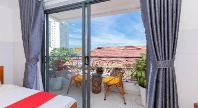 Bed in OYO 1028 Flower House Apartment