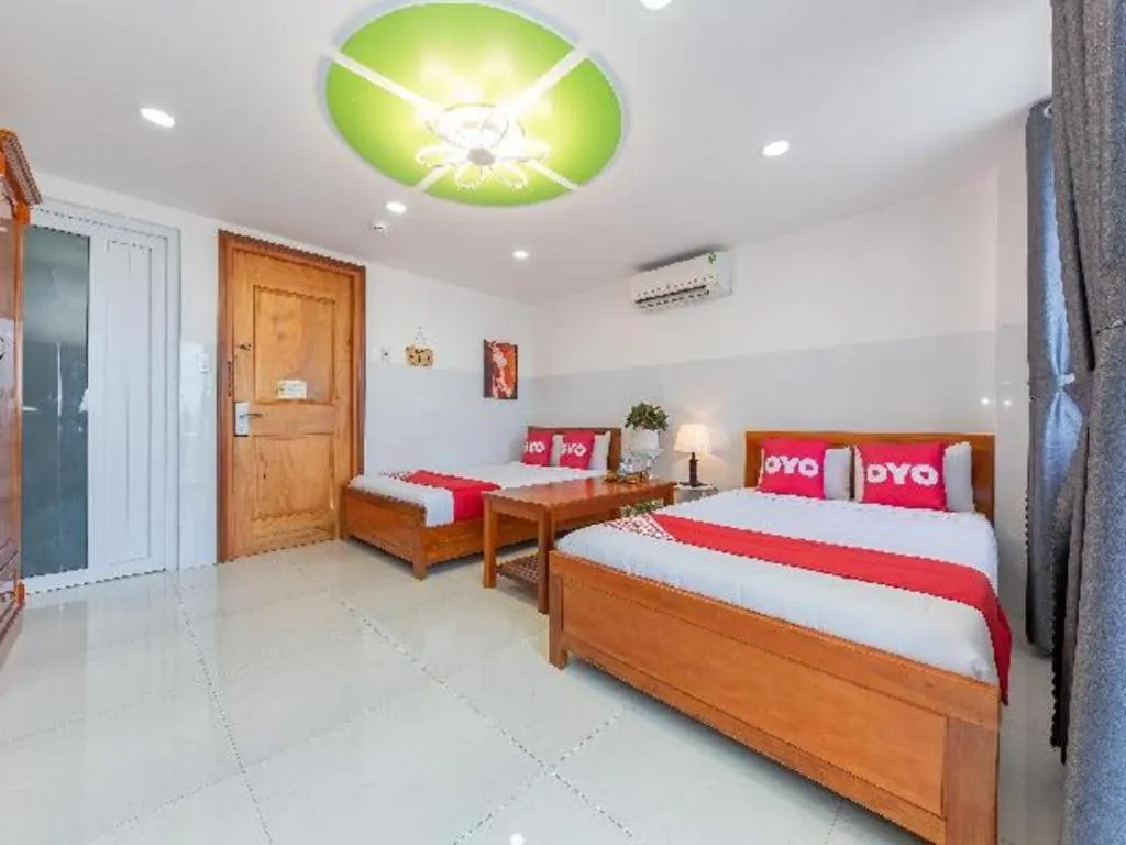 Bed in OYO 1028 Flower House Apartment