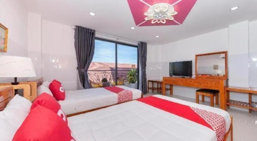 Bed in OYO 1028 Flower House Apartment