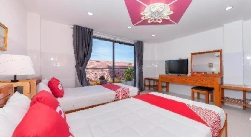 Bed in OYO 1028 Flower House Apartment