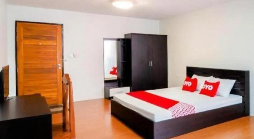 Bed in OYO 935 The Palm Apartment