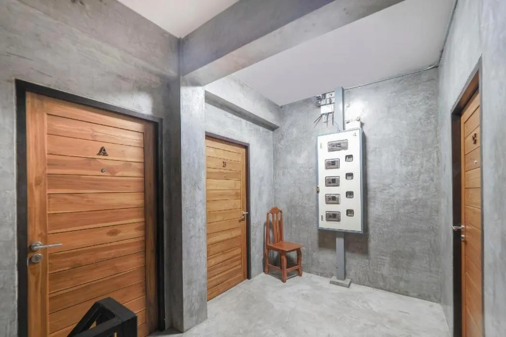 Bed in OYO 935 The Palm Apartment