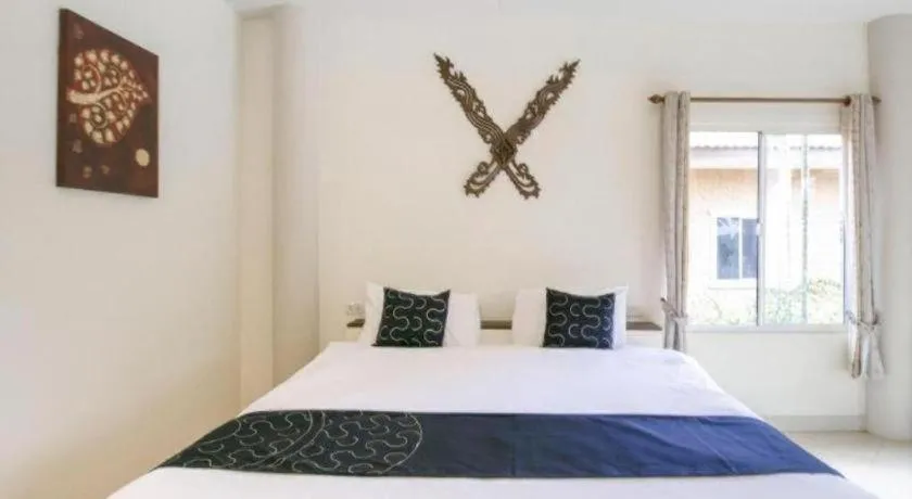 Bed in CAPITAL O961 Baan Dow Chompoo Resort