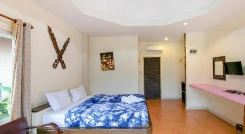 Bed in CAPITAL O961 Baan Dow Chompoo Resort