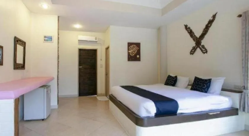 Bed in CAPITAL O961 Baan Dow Chompoo Resort