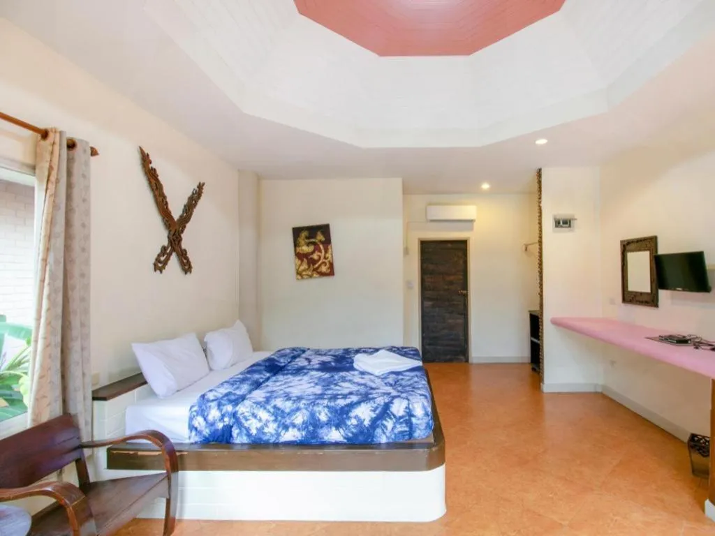 Bed in CAPITAL O961 Baan Dow Chompoo Resort