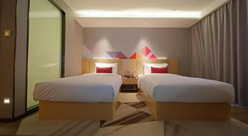 Bed in Borrman Hotel Zhaoqing Sihui Tianguangxu Jade City