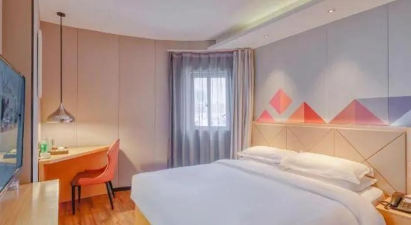 Bed in Borrman Hotel Zhaoqing Sihui Tianguangxu Jade City