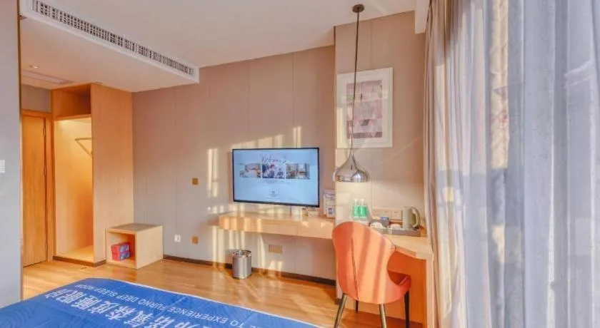 Bed in Borrman Hotel Zhaoqing Sihui Tianguangxu Jade City