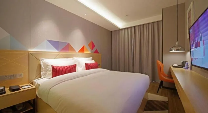 Bed in Borrman Hotel Zhaoqing Sihui Tianguangxu Jade City