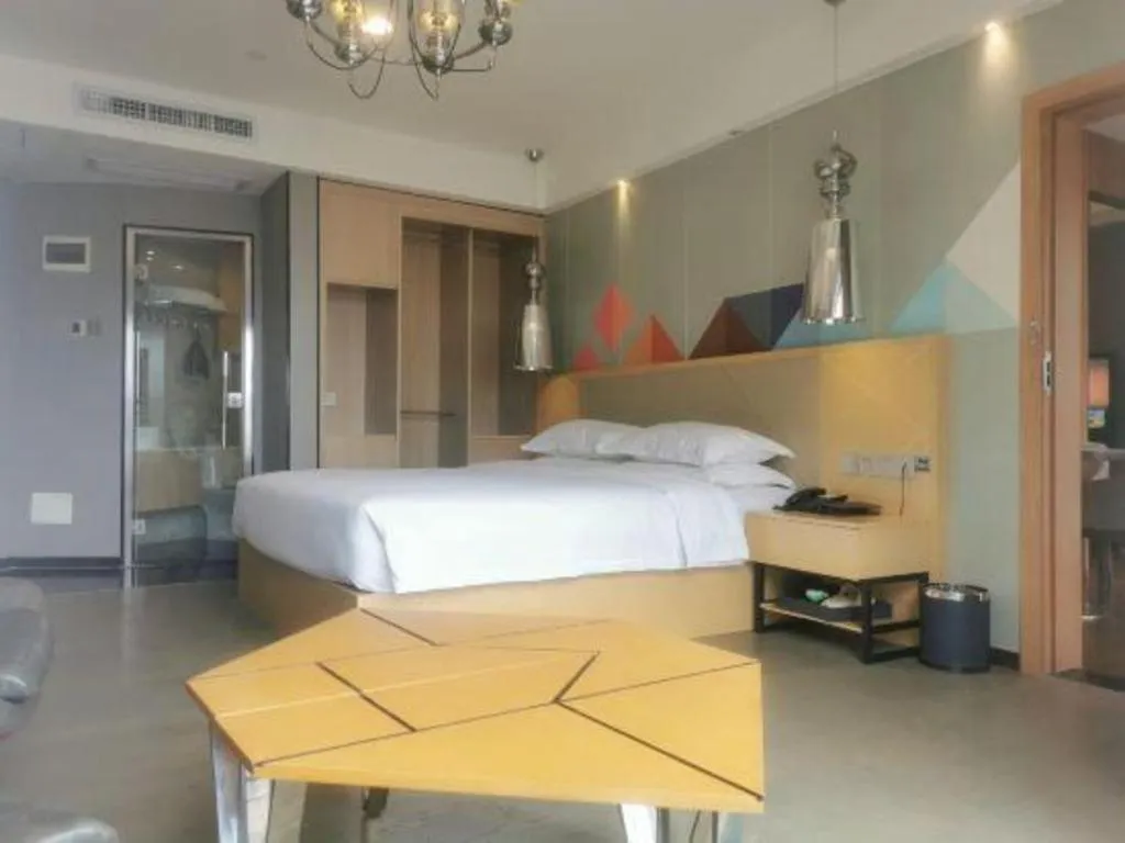 Bed in Borrman Hotel Zhaoqing Sihui Tianguangxu Jade City